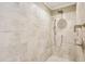 The shower features a rainfall showerhead with a handheld attachment for the ultimate spa experience at 411 Circle Dr, Burlington, NC 27215