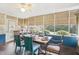 Cozy sunroom with wood floors, paneled ceiling, and screened windows at 411 Circle Dr, Burlington, NC 27215