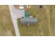 Aerial view of ranch property with home and outbuilding, showcasing a large lot at 4194 Abattoir Rd, Angier, NC 27501