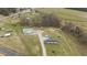 Expansive aerial view of an entire homesite with home, outbuilding, and large yard at 4194 Abattoir Rd, Angier, NC 27501