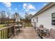 A lovely back deck featuring ample seating, perfect for enjoying the outdoors with Gathering and friends at 4194 Abattoir Rd, Angier, NC 27501