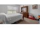 Bright bedroom features a large window and plush carpet at 4194 Abattoir Rd, Angier, NC 27501