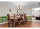 Charming dining room featuring hardwood floors, wood table and decorative light fixture at 4194 Abattoir Rd, Angier, NC 27501