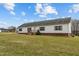 Exterior view of home with front lawn, wooden porch, and well maintained siding at 4194 Abattoir Rd, Angier, NC 27501