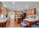 Spacious kitchen with ample cabinets, central island, stainless steel appliances, and eat-in counter at 4194 Abattoir Rd, Angier, NC 27501
