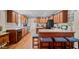 Spacious kitchen with wood cabinets, island, and modern black appliances at 4194 Abattoir Rd, Angier, NC 27501