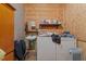 Rustic laundry room with washer, dryer, and utility sink at 4194 Abattoir Rd, Angier, NC 27501
