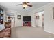 Living room featuring neutral walls, carpeting, and a view into the kitchen and bathroom at 4194 Abattoir Rd, Angier, NC 27501