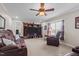 Large living room with plenty of seating and a ceiling fan at 4194 Abattoir Rd, Angier, NC 27501