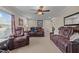 Spacious living room with comfortable reclining furniture and natural light at 4194 Abattoir Rd, Angier, NC 27501