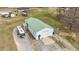 Aerial view of a metal outbuilding with a green roof, showcasing its size and location at 4194 Abattoir Rd, Angier, NC 27501