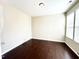 Inviting bedroom featuring hardwood floors, a neutral color scheme, and ample natural light at 4519 Tarkiln Pl, Wake Forest, NC 27587