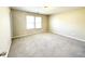 Spacious bedroom with plush carpeting and large windows for ample natural light at 4519 Tarkiln Pl, Wake Forest, NC 27587
