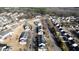Aerial view of a well-planned residential neighborhood with tree-lined streets and neatly arranged houses at 4519 Tarkiln Pl, Wake Forest, NC 27587