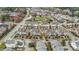 Aerial view of a community with townhouses and a community greenspace in the middle of the neighborhood at 556 Village Loop Dr, Apex, NC 27502