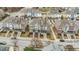 Aerial view of colorful townhouses, landscaping and cars at 556 Village Loop Dr, Apex, NC 27502