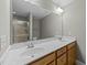 Bathroom with a double vanity, large mirror and walk-in shower at 556 Village Loop Dr, Apex, NC 27502