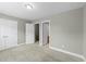 The bedroom has neutral walls, carpeted floors and two doors at 556 Village Loop Dr, Apex, NC 27502