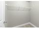 Small walk-in closet with a wire shelf at 556 Village Loop Dr, Apex, NC 27502