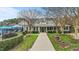 Exterior front view of the clubhouse at a neighborhood swimming pool with a covered patio at 556 Village Loop Dr, Apex, NC 27502