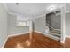 Hardwood floors, neutral color, recessed lights and views into the kitchen highlight this welcoming and bright open space at 556 Village Loop Dr, Apex, NC 27502