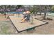 Well-maintained community playground with slides and swings, ideal for Gathering fun and social interaction at 556 Village Loop Dr, Apex, NC 27502