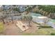 Community playground featuring modern play structures and safe, cushioned ground for to enjoy outdoor activities at 556 Village Loop Dr, Apex, NC 27502