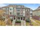 Charming townhomes feature a mix of brick and siding exteriors and inviting front porches at 556 Village Loop Dr, Apex, NC 27502