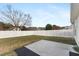 Backyard featuring a concrete patio area and a privacy fence, perfect for outdoor enjoyment at 600 Cuddington Ln, Nashville, NC 27856