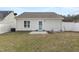 Backyard featuring a home generator and a small patio area for relaxing outdoors at 600 Cuddington Ln, Nashville, NC 27856