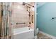 Bathroom with a tub and shower, black fixtures, and decorative shower curtain at 600 Cuddington Ln, Nashville, NC 27856