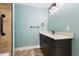 Bathroom featuring a stylish vanity with dark wood cabinets and modern fixtures at 600 Cuddington Ln, Nashville, NC 27856