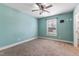 Bedroom with neutral carpet flooring, a ceiling fan, and window with blinds at 600 Cuddington Ln, Nashville, NC 27856