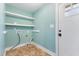Laundry room with shelves and hookups, offering practicality and storage space at 600 Cuddington Ln, Nashville, NC 27856