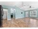 Open-concept space with modern lighting, views of the kitchen, access to the bathroom, and a bright white door at 600 Cuddington Ln, Nashville, NC 27856