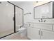 Modern bathroom featuring glass enclosed shower, sleek vanity, and stylish tile flooring at 604 Edmund St, Raleigh, NC 27604