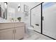 Modern bathroom featuring dual shower head, sleek vanity, and stylish tile flooring at 604 Edmund St, Raleigh, NC 27604