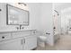 Bright bathroom with tub and shower combo and a classic white vanity at 604 Edmund St, Raleigh, NC 27604