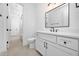 Bathroom featuring long view to shower, toilet and vanity sink with black fixtures at 604 Edmund St, Raleigh, NC 27604