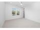 Bright bedroom with plush carpet and a large window offering natural light at 604 Edmund St, Raleigh, NC 27604
