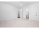 Spacious bedroom featuring plush carpet and a doorway to a private bathroom at 604 Edmund St, Raleigh, NC 27604