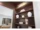 Built-in shelving with decorative vases and view of the living room at 604 Edmund St, Raleigh, NC 27604