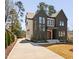 Stunning two-story home with a modern design, dark exterior and double door entry at 604 Edmund St, Raleigh, NC 27604