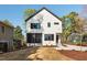 Two story home with white siding, dark trim and a lawn at 604 Edmund St, Raleigh, NC 27604