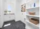 Clean laundry room featuring built in shelving, modern appliances, and sink at 604 Edmund St, Raleigh, NC 27604