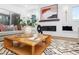Cozy living room featuring a fireplace, stylish artwork, and a comfortable seating area at 604 Edmund St, Raleigh, NC 27604