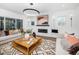 Bright living room with a modern fireplace, stylish decor, and comfortable seating arrangement at 604 Edmund St, Raleigh, NC 27604
