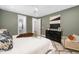 Relaxing main bedroom featuring a neutral color palette, soft rug, and ample closet space at 604 Edmund St, Raleigh, NC 27604