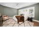 Comfortable main bedroom with a plush rug, ceiling fan, and windows providing natural light at 604 Edmund St, Raleigh, NC 27604