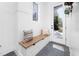 Bright mudroom with built-in bench, storage, and tiled floors at 604 Edmund St, Raleigh, NC 27604